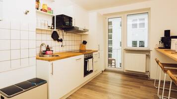 Family Triple Room, Kitchen, City View | Private kitchen | Fridge, microwave, stovetop, electric kettle