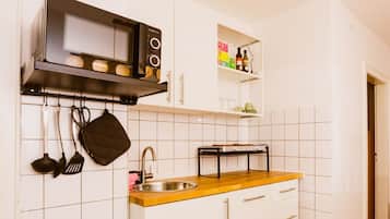 Family Quadruple Room, Kitchen, Courtyard View | Private kitchen