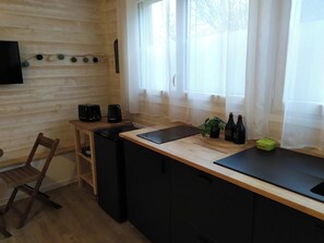 Fridge, microwave, stovetop, coffee/tea maker