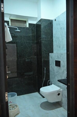 Deluxe Studio Suite | Bathroom | Free toiletries, towels, shampoo, toilet paper - The Ravishya Retreat (Ayodhya)