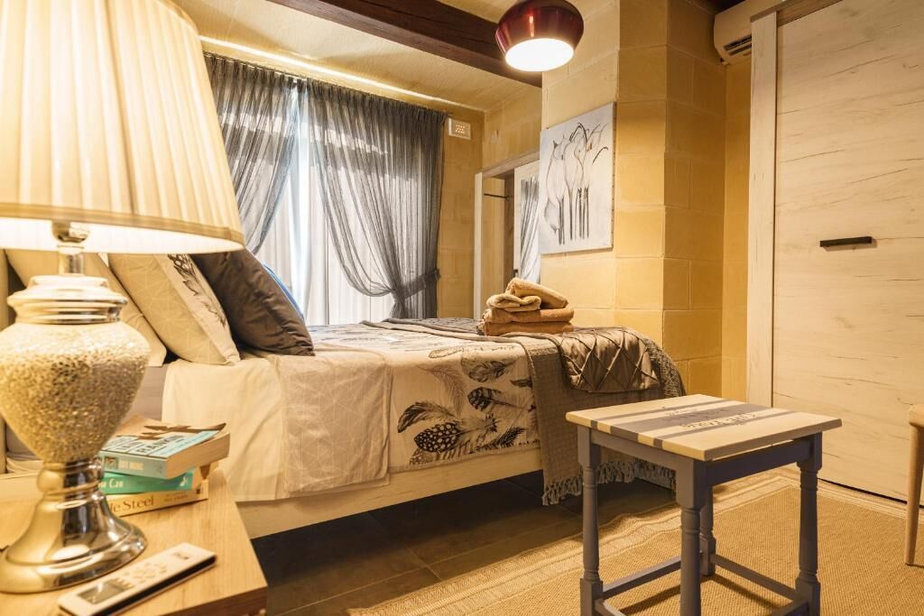 Deluxe Suite, 2 Bedrooms, Sea View | Blackout drapes, iron/ironing board, free WiFi