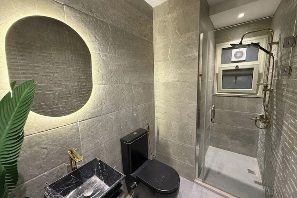 Shower, towels, soap, toilet paper