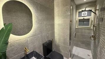 Shower, towels, soap, toilet paper