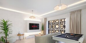 A modern living room with a pool table, a Netflix sign, a large window with curtains, and a decorative wall panel. - LUX The Contemporary Marina View Suite 4 (Dubai)