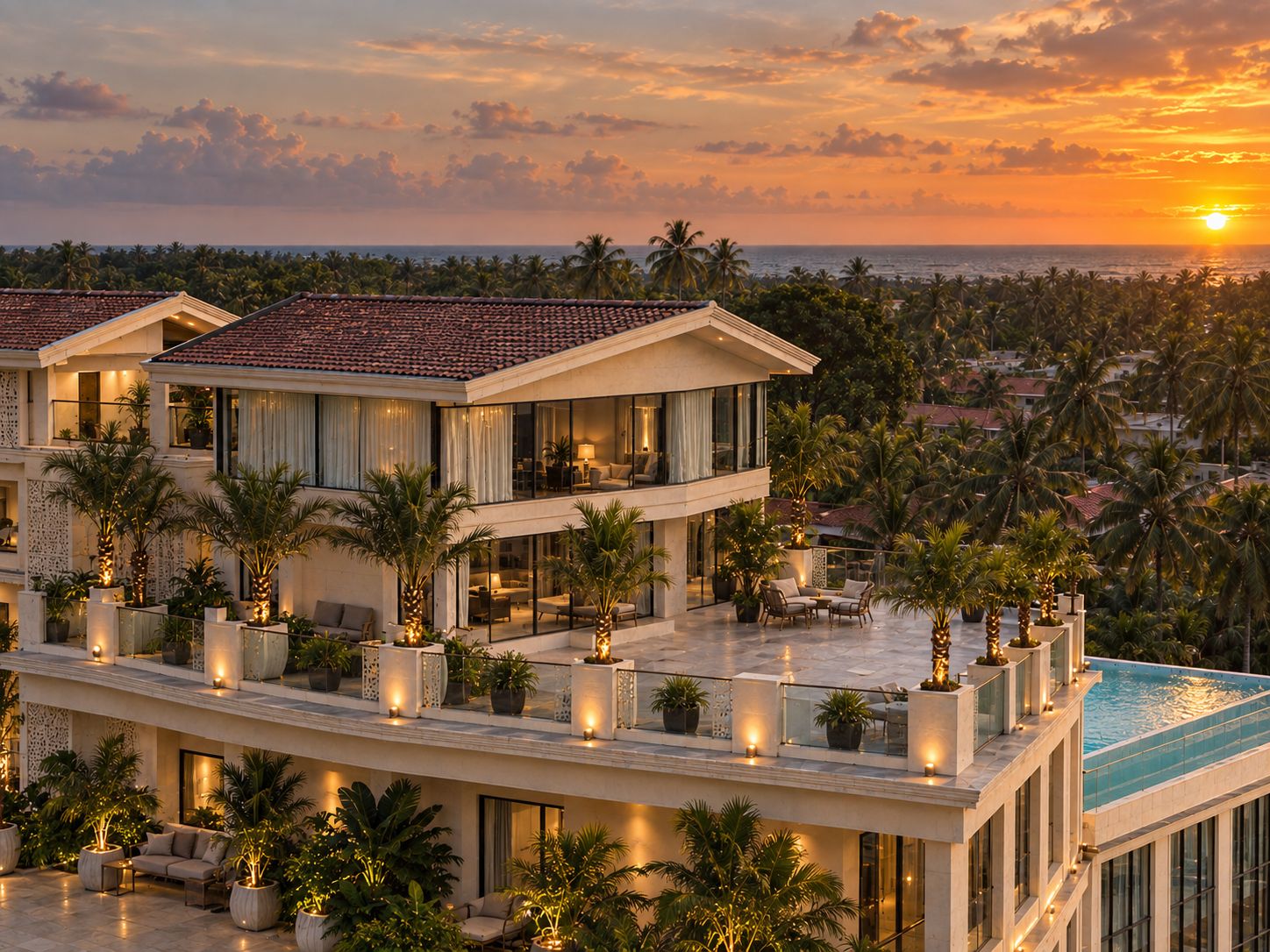 A multi-story resort with a pool, outdoor seating, and palm trees.