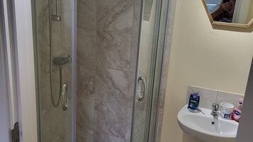 Shower, hair dryer, towels, soap
