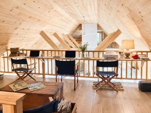A wooden interior with a high ceiling, a wooden desk with two chairs, a laptop, and a printer. - French-flair coastal retreat in Port-Clyde (St. George)