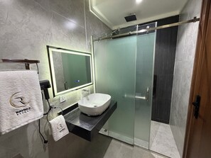 Signature Room, City View | Bathroom | Shower, hair dryer, slippers, towels - Raynez Resort (Abuja)