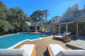 Outdoor pool, a heated pool - 206 N. Sea Pines Drive – Luxury Resort-Style Living (Hilton Head Island)