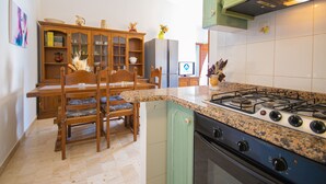 Fridge, oven, stovetop, cookware/dishes/utensils - Capo Comino 1 - Two Bedroom Apartment, Sleeps 5 (La Caletta)