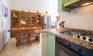 Fridge, oven, stovetop, cookware/dishes/utensils - Capo Comino 1 - Two Bedroom Apartment, Sleeps 5 (La Caletta)