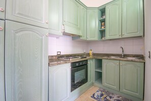Fridge, oven, stovetop, cookware/dishes/utensils - Capo Comino 2 - Two Bedroom Apartment, Sleeps 5 (La Caletta)