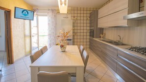 Fridge, oven, stovetop, cookware/dishes/utensils - Mandras 1 - One Bedroom Apartment, Sleeps 4 (La Caletta)