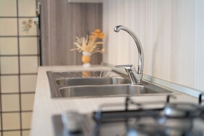 Fridge, oven, stovetop, cookware/dishes/utensils - Mandras 1 - One Bedroom Apartment, Sleeps 4 (La Caletta)