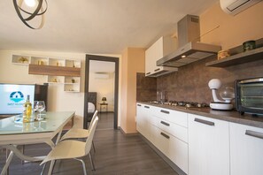 Fridge, microwave, stovetop, cookware/dishes/utensils - La Caletta 4 - Two Bedroom Apartment, Sleeps 4 (La Caletta)