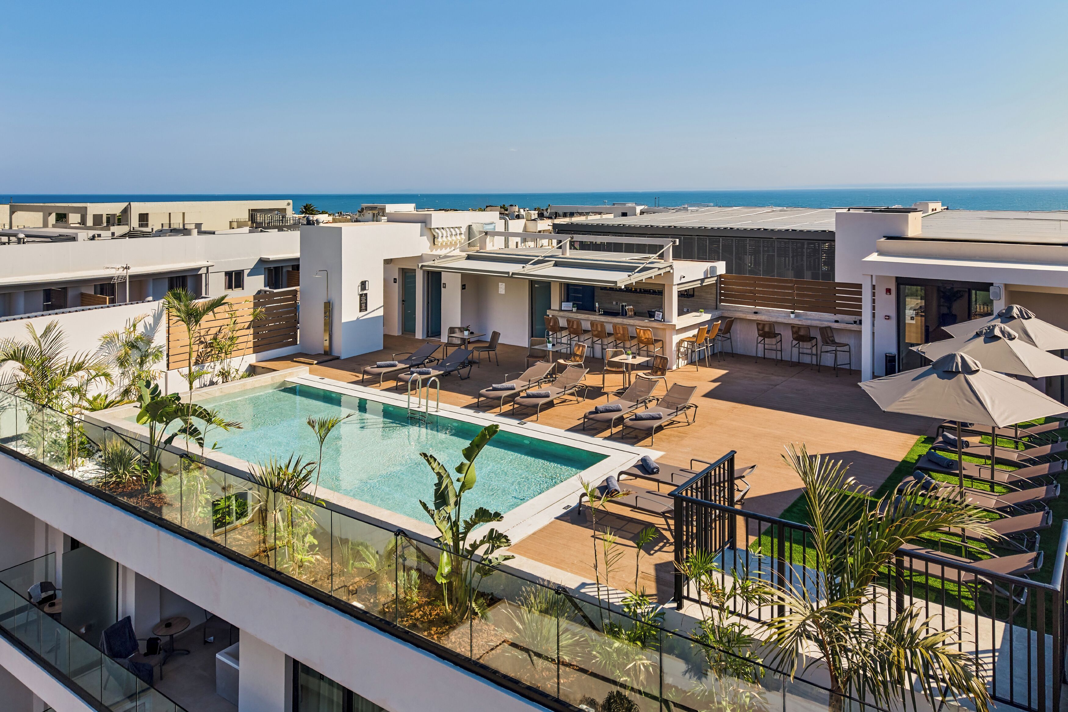 Seasonal outdoor pool, pool umbrellas, pool loungers