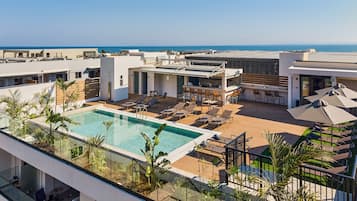 Seasonal outdoor pool, pool umbrellas, pool loungers