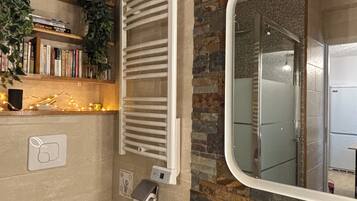 Shower, towels, toilet paper