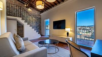 Luxury Studio Suite, 1 Bedroom, Terrace | Living area | 50-inch Smart TV with digital channels