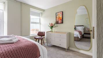 Premium bedding, Select Comfort beds, blackout curtains, travel cot