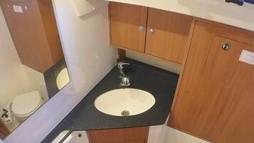 Shower, towels, soap, toilet paper