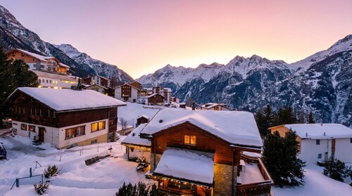 Charming Swiss chalet with stunning mountain views.