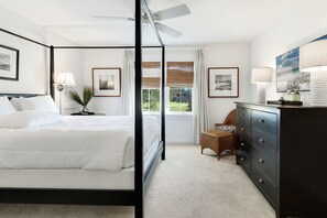 Unwind in your elegant master bedroom with a luxurious four-poster bed, crisp linens, and peaceful garden views through bamboo blinds. - Stunning Pet Friendly Home Ravens Run (Miramar Beach)