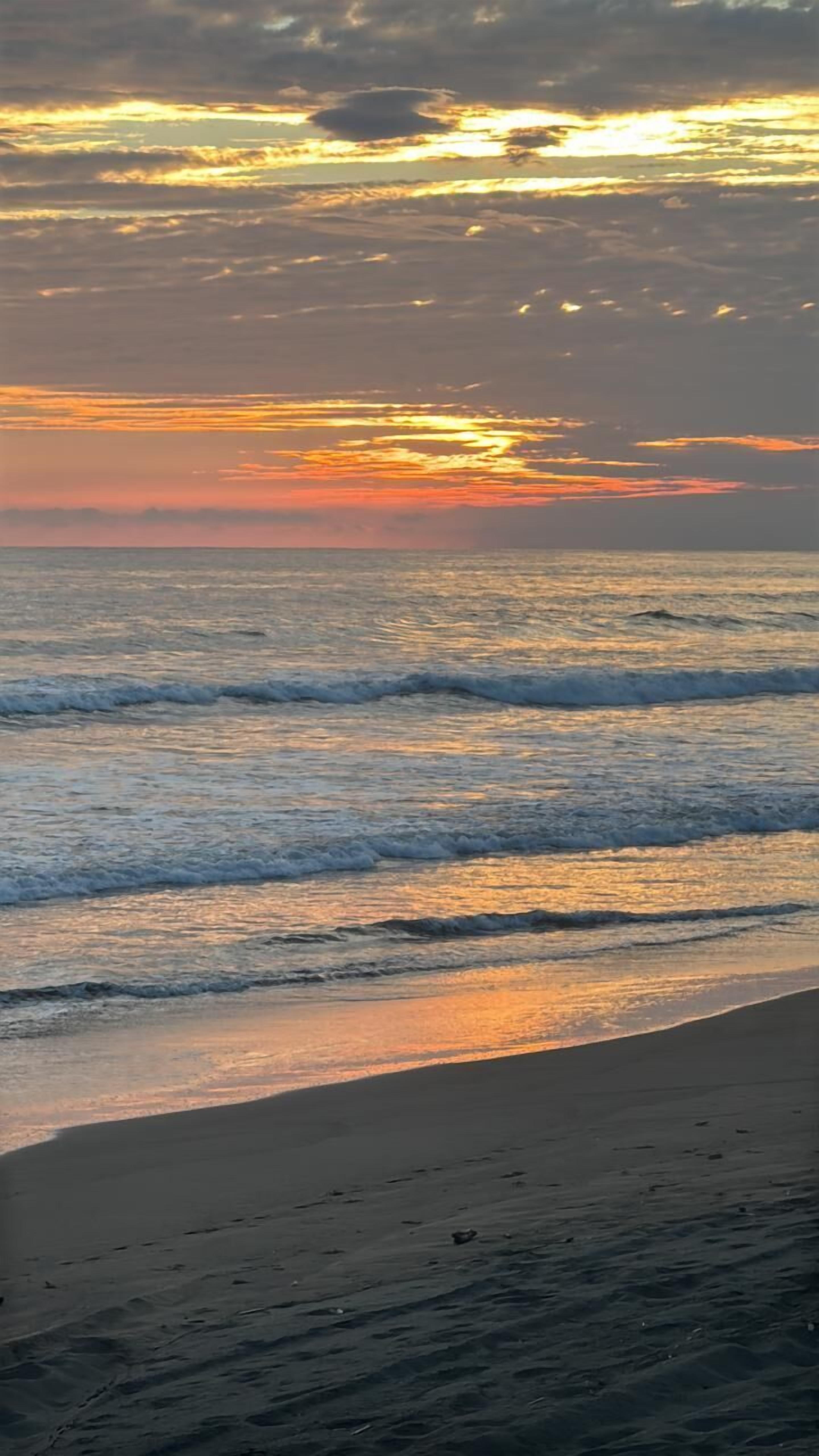 On the beach, black sand