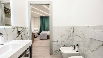 Family Triple Room, Balcony, Courtyard View | Bathroom | Shower, rainfall showerhead, free toiletries, hair dryer