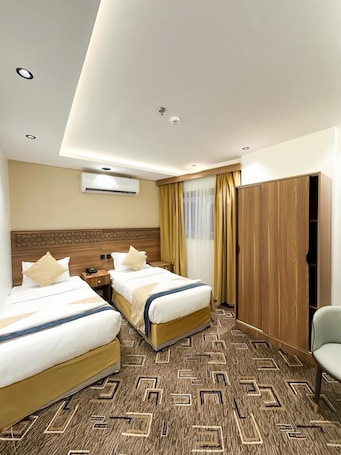 Premium bedding, Select Comfort beds, free WiFi, bed sheets. Makin Hotel