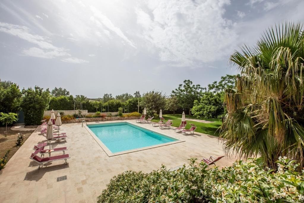 Seasonal outdoor pool, pool umbrellas, pool loungers