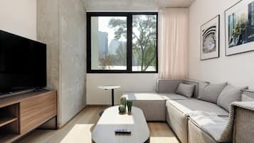 Apartment, 2 Bedrooms | Living area | Flat-screen TV, heated floors