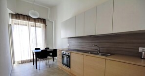 Superior Apartment | Private kitchen | Full-size fridge, stovetop, cookware/dishes/utensils - La Perla del Mare di Polignano Apts (Polignano a Mare)