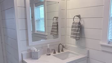 Shower, towels, soap, toilet paper