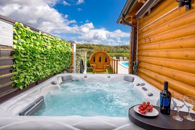 Peaceful countryside retreat with pool, jacuzzi, sauna, tennis, and river views.