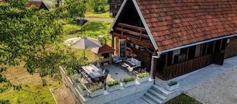 Charming wooden riverside home for peaceful family stay and nature escape.