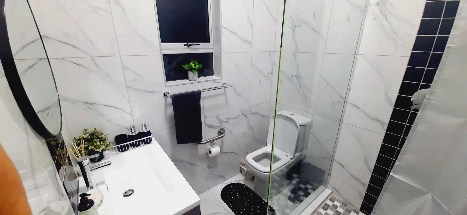 Shower, towels, soap, toilet paper