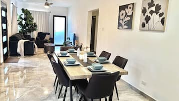 Superior Apartment, Balcony | Living area | 50-inch flat-screen TV with cable channels