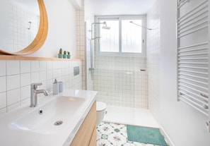 Shower, hair dryer, towels, soap