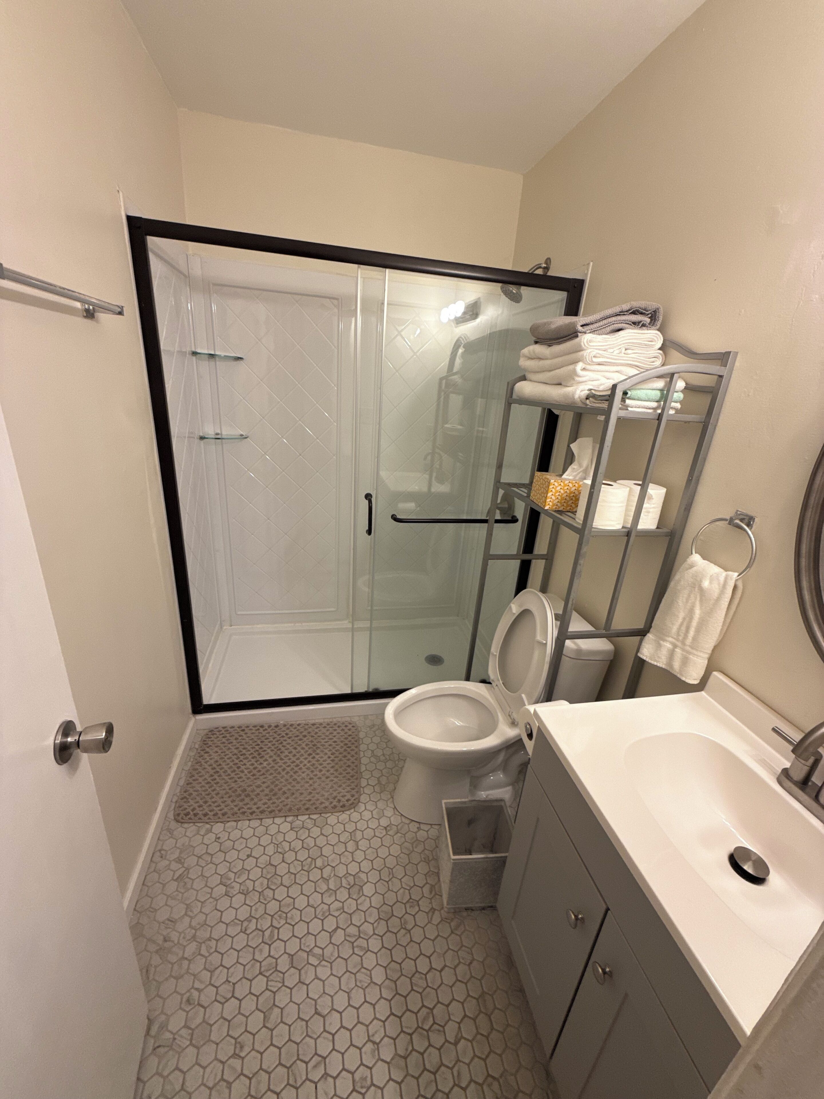 Shower, hair dryer, towels, soap