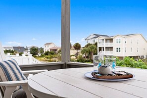 Outdoor dining - Dolphin Delight 𓇼 Ocean Views + Beach Walkable (Oak Island)