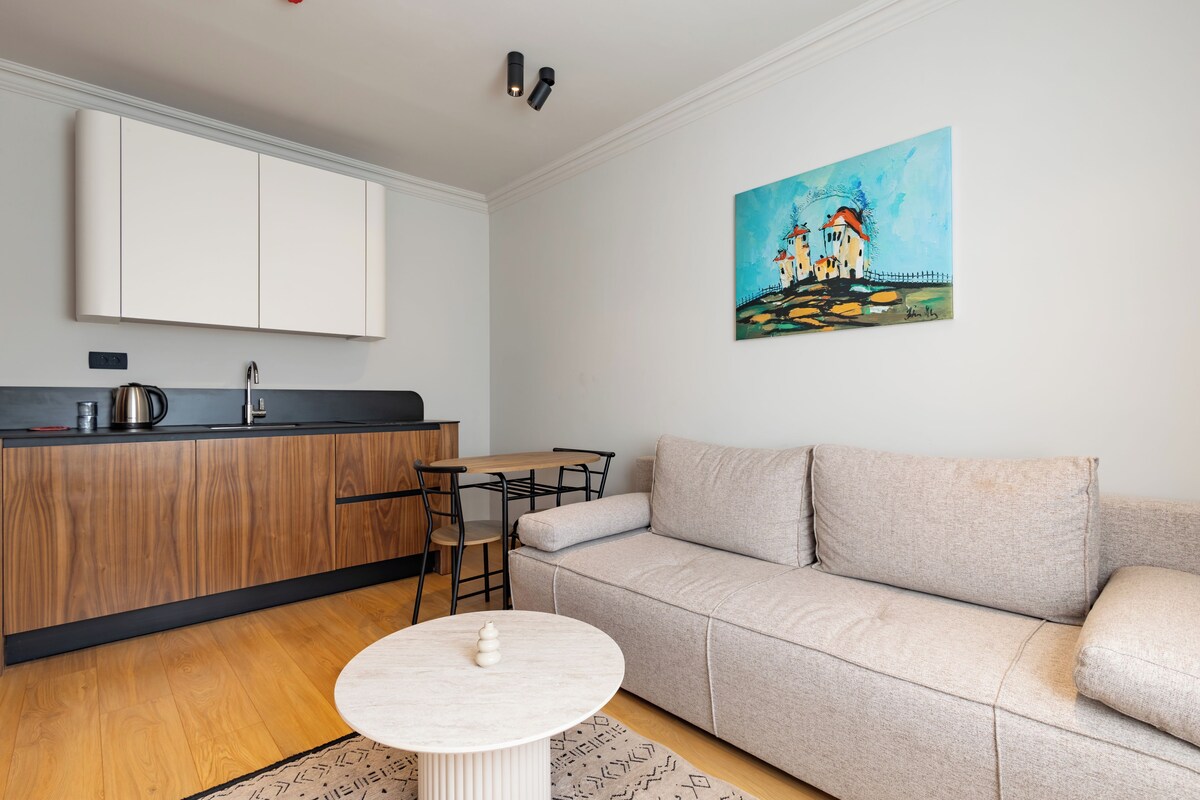 Standard Apartment | Living area | 43-inch TV with digital channels