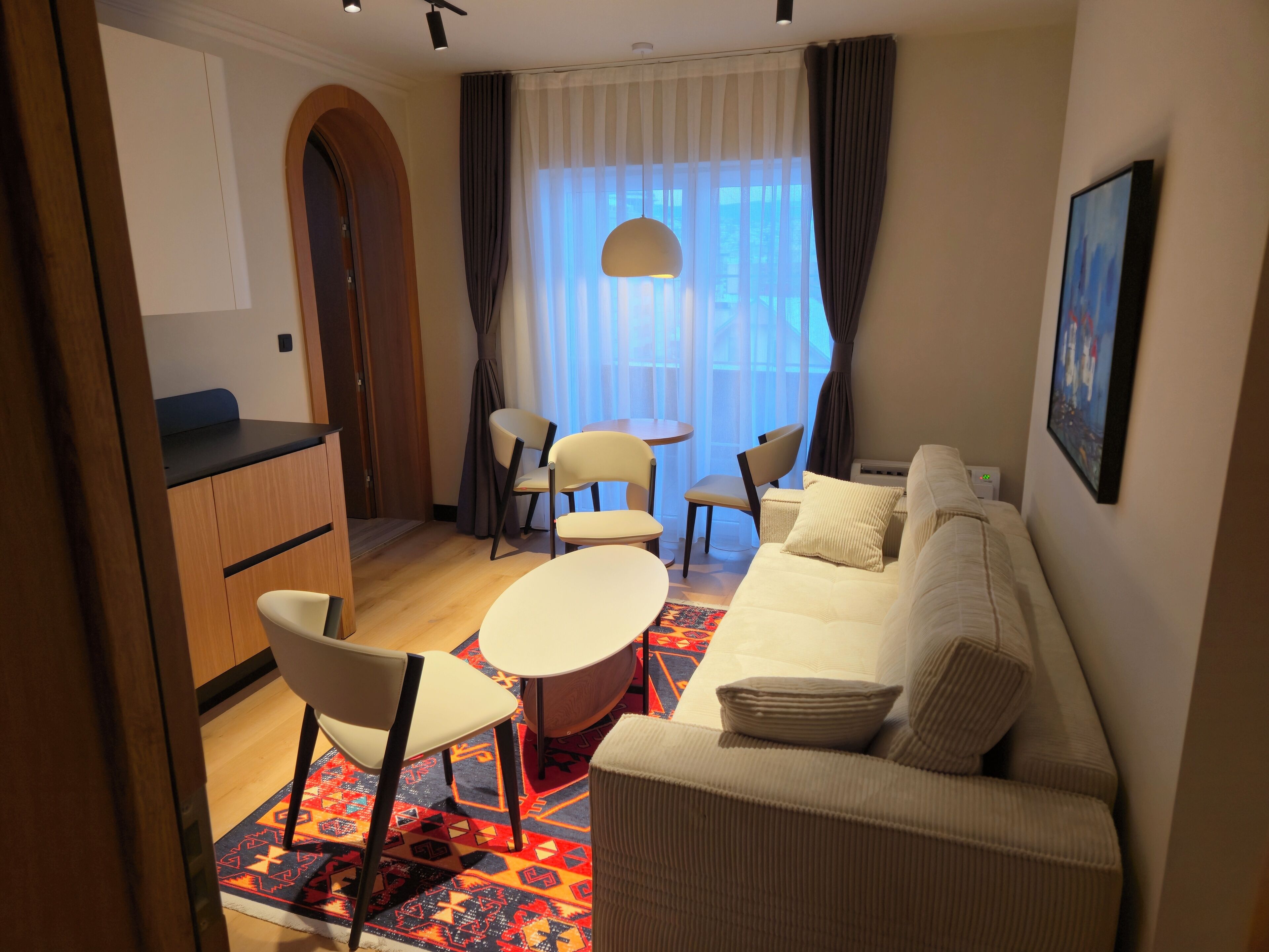 Apartamento superior, vista para a cidade | Área de estar