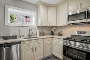 Fridge, microwave, oven, stovetop - Modern DC Condo w/ Free Parking Permit & City Access (Washington)