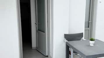 Habitación triple superior | Terraza o patio