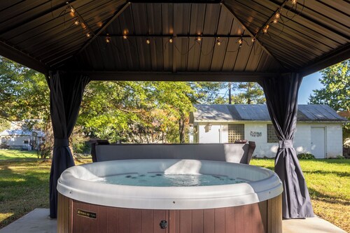 Cozy two bedroom home with hot tub, playroom and fire pit.