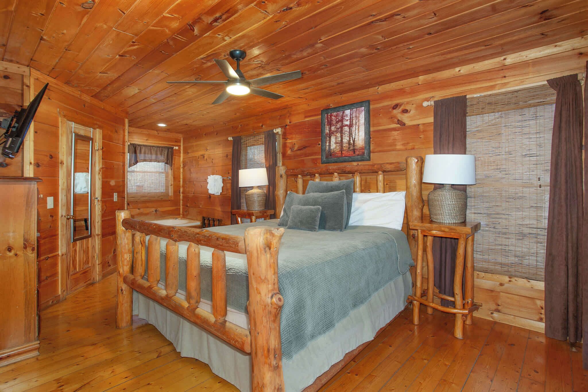 Bedroom 1 with king bed, smart TV, in-room jacuzzi tub, and ensuite bath