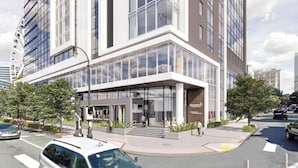 A modern building with large glass windows and a prominent entrance. - Downtown ATL Presidential Suite, Near Benz Stadium (Atlanta)