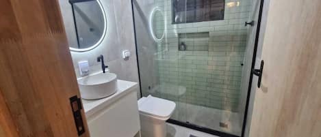 Shower, hair dryer, towels, soap
