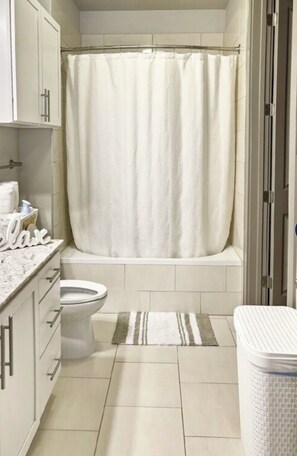 Hair dryer, towels, soap, toilet paper